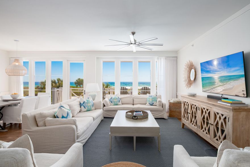 This stunning third-floor condominium in WaterSound Beach offers a rare combination of breathtaking gulf views, effortless luxury and the ease of a low-maintenance lifestyle. Recently remodeled by Urban Grace Interiors, the residence features new furniture, fresh paint, custom wallpaper, designer lighting and curated artwork, creating a refined coastal retreat. Thoughtfully designed for comfort and style, this three-bedroom, three-bathroom residence spans 1,980 square feet and is one of the few units in the community that directly overlooks the pool and outdoor fireplace, offering unparalleled views of the Gulf of America. An open-style gourmet kitchen anchors the home, complete with a suite of stainless-steel appliances, a wine cupboard and an oversized center island perfect for casual