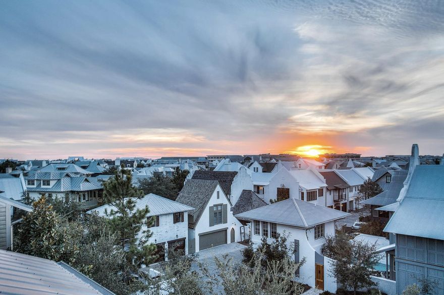 Welcome to 5 Johnstown Lane, an exquisite four-story home situated in the heart of Rosemary Beach that is the BEST PRICED HOME PER SQUARE FOOT on the market in Rosemary Beach! And to top it off, the highly-motivated seller is offering a $50,000 CONCESSION towards upgrades and improvements! Overlooking the St. Augustine Green in Rosemary Beach, this fully-furnished, elevator-equipped, four-story home is a must-see! Enjoy the panoramic views of the lush greenery and Rosemary Beach from every level, featuring balconies on the second, third, and fourth floors. One of our favorite features of this home is the wrap-around rooftop balcony. This is one of only 13 homes in Rosemary Beach with a tower designation, so the view over the hundreds of other homes is incredible! The allure continues with APPROVAL from the town architect for a PRIVATE POOL or CARRIAGE HOUSE to enhance the outdoor experience if desired.

With its reverse floor plan and wrap-around balconies, the only tough choice you'll make once you arrive is which views to enjoy and where.  This beautiful residence is light and bright, decorated in neutral colors and illuminated by natural light flooding in through the many windows. The rustic modern fixtures throughout complement the gorgeous dark wood floors beautifully. 

This lovely 4-story home is equipped with a private elevator and accommodates up to 15 people with 5 bedrooms, 4.5 baths, plus an additional bunk room; great for multiple families with over 3,500 sq ft of space. There are two guest suites and a wet bar on the first floor, each room complete with a king bed, private bath with custom tile shower, and a large closet. 

Another guest suite, as well as the master suite, can be found on the 2nd floor, each with a king bed, private bath, and walk-in closet. The master suite features a private balcony, a wet bar, double vanities, a large soaking tub with treetop views, and a custom tile shower. 

Continuing upward, the kitchen, living, dining and powder room are located on the 3rd floor with an open concept and an abundance of light. The kitchen is full of upgrades, including granite counter tops, a wine cooler, stainless steel decor, Kitchen Aid appliances, and a custom backsplash. There is another wrap-around balcony overlooking St. Augustine Green off the living room where the grill is located conveniently close to the kitchen. 

The fourth floor completes this residence with additional living space, a bunk room with three twin beds, and a wrap-around roof top balcony, where you can relax and enjoy sunset views and concerts in St. Augustine Park.

This home not only captures stunning views of the St. Augustine Green from every level, but is also in a great location. There is a water park with a splash pad for the kids and adults to cool off just beyond the front door. Not to mention the dining and shopping of Rosemary Beach's town square is a short 3 minute walk or quick bike ride away. Enjoy the exclusive amenities of Rosemary Beach, including four community pools, an owner's-only club just steps away from 5 Johnstown Lane, tennis courts, expansive green spaces, a gym, fitness trails, and much more. 

Come discover a world of luxury, comfort, and relaxation in this Rosemary Beach retreat!