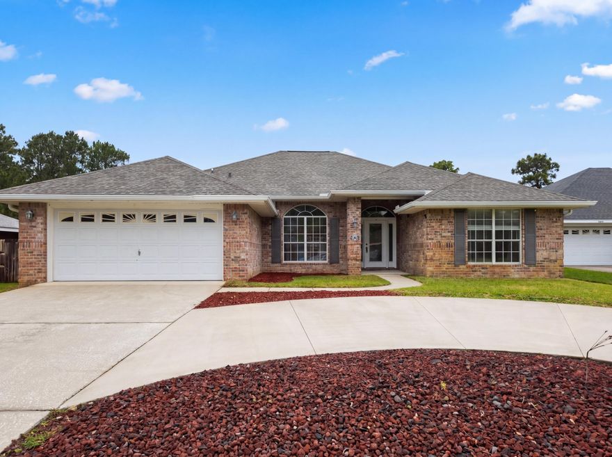 Explore 9564 Pouder Ln, featuring new hvac and partial flooring replacement. A fireplace highlights the living space; the kitchen contains all stainless steel appliances. The primary bedroom includes a walk in closet, and its bathroom provides double sinks plus a separate tub and shower. A patio connects to a fenced in backyard. This home presents practical updates for comfortable living.