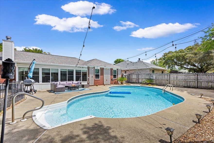 Discover Florida living at its best in this beautiful all-brick pool home located in Villa Danielle, a waterfront community with neighborhood water access, all in desirable Flood Zone X. Designed for both comfort and function, this home offers a spacious split floor plan with 4 generously sized bedrooms, a formal dining room, a cozy breakfast nook, and a bright heated and cooled sunroom perfect for year-round enjoyment. The inviting living room features vaulted ceilings, oak hardwood floors, and a charming wood-burning fireplace.
The updated kitchen blends style and practicality with modern slate appliances, quartz countertops, and a large stainless-steel sink, making it ideal for everyday living and entertaining. Step outside to your own private backyard retreat complete with a large pool expansive patio, and plenty of lawn space for relaxing, hosting guests, or soaking up the Florida sunshine.

Major updates include a new roof in 2019, new windows in 2017, a new pool liner in 2021, and a new water heater in 2025.