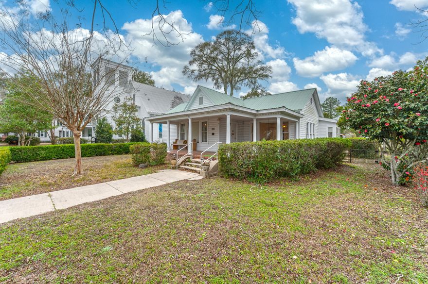 On iconic Circle Drive, this is more than a home, it is a front row seat to Lake DeFuniak and the historic Chautauqua Hall of Brotherhood. This is Circle Drive lifestyle, morning walks around the lake, community events steps away, and sunset views from your own living room. Tucked between St. Agatha's Episcopal Church and open space, you'll enjoy rare privacy while remaining close to downtown shops and dining.
Inside, living and dining spaces frame sweeping water views. The updated kitchen flows to a mudroom built for real life. Bedrooms and flex space open to a shaded back porch. Covered parking leads to a heated and cooled workshop with plumbing and electrical, ideal for a studio or guest space. Whole house generator included. Just 30 minutes to the Emerald Coast beaches. Inside, the living and dining rooms capture sweeping lake views, while the updated kitchen connects to a utility/mud room for added convenience. The primary suite, additional bedrooms, and flexible den open to a shaded back porch. A covered parking area leads to a heated and cooled workshop with plumbing and electricalideal for a studio, workspace, or future conversion. A whole-house generator adds peace of mind. Located in DeFuniak Springs, just 30 minutes from sugar-white beaches, this is a rare Circle Drive opportunity.