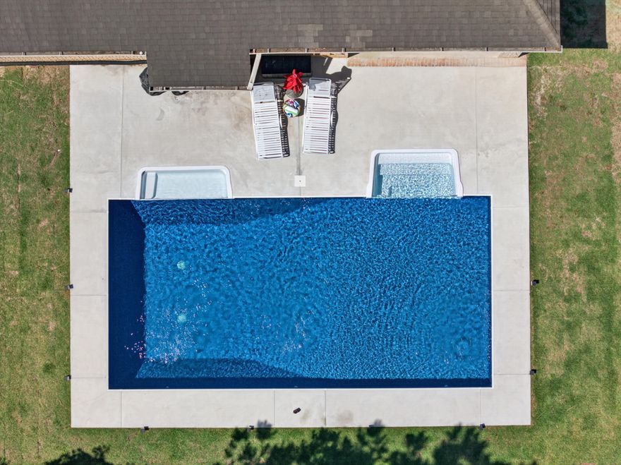 Turning Go Big or Go Home into an address Is what 49 Harmony Way does. This is the kind of home that stops you mid-scroll- bold in size, this 3,750-square-foot residence delivers a combination of polished design, functional space, and outdoor living that includes a new saltwater pool-all within one of Hammock Bay's most intimate and charming neighborhoods.  Harmony way is  a quaint 19-home cul-de-sac where every home backs to the nature preserve, offering a level of privacy and breathing room that is becoming increasingly hard to find. Sitting on .36 acres with an oversized courtyard driveway and side-load garage, the curb appeal immediately sets the tone: substantial, elevated, and anything but cookie-cutter.
Inside, the layout simply works. The open-concept design creates natural flow between the main living spaces while still offering the flexibility that today's families want. Dedicated office? Check. Formal dining room? Absolutely. Bonus craft room? Yes. Massive 26x13 fifth bedroom that could become the ultimate media room, game room, teen retreat, or second living area? You got it. The finish selections strike a balance between timeless and current with luxury vinyl plank flooring, granite countertops throughout, crown molding accents, generous storage, and spacious rooms.
Then there's the backyard -The in ground saltwater pool, covered lanai, privacy fencing, preserve views, and additional storage shed create an outdoor setup designed for everything from laid-back evenings to full-scale entertaining. This isn't just a backyard... it's your own private escape.
And life in Hammock Bay? That's an entirely different level of living. More than a neighborhood, it's a full lifestyle experience designed around connection, and convenience. Residents enjoy:
-Three beautifully designed clubhouses, including multiple zero-entry resort-style pools
-State-of-the-art fitness center
-Tennis, basketball, and pickleball courts
-Miles of walking and jogging trails woven throughout the community
-Community General Store, green event spaces, playgrounds, and dog parks
-Dock overlooking the bay
-Community events and seasonal markets that actually make neighbors feel like neighbors!
Just minutes from the white-sand beaches of 30A, South Walton dining, boating, and shopping, 49 Harmony Way delivers the space families want,  and the lifestyle everyone's chasing. Big on personality. Big on functionality. Big on Memories made! Call for a private tour today.
