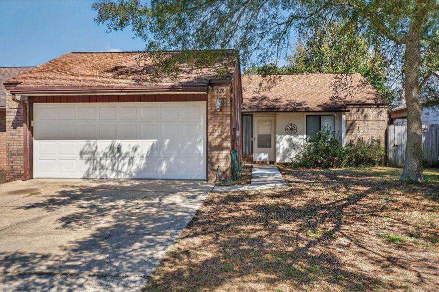 Home Sweet Garden Home! New laminate flooring in foyer, kitchen & baths and freshly painted. Located in Niceville's sought-after Cedar Ridge with underground utilities and sidewalks, but no HOA, this two-bedroom, two full-bath, two-car garage home offers comfort and style; a place to truly feel at home. Spacious living room with a cathedral ceiling features a beautiful brick fireplace with wood accents and brand-new carpeting. A charming galley-style kitchen features a gas range, original wood cabinetry, an open view of the living room, and a breakfast area with a lovely Tiffany-style light fixture, sure to be a conversation starter. The roomy bedrooms also have brand-new carpet for your comfort. Two full baths, extra closet areas, and the garage/laundry storage mean more organized living It's not called a garden home without space for exterior enjoyment, and this home delivers. Two wide patio doors open to a private, fully fenced backyard, also accessible through a side gate. Each doorway leads to covered porches. Isn't it time to start enjoying quiet times in your own space? ideal for weekend barbecues, pets, playtime, or simply relaxing in your own private outdoor space. There might be a few great things not described herein, so you need to come visit today;)