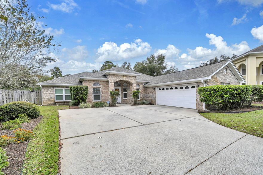 This well-maintained, single-owner brick contemporary residence is centrally located in Fort Walton Beach. Built in 2004, the home offers four large bedrooms with a desirable split-floor plan, including an oversized master suite and a spacious bathroom. Hardwood floors enhance the living and dining areas, while tile is featured in the kitchen and bathrooms. The kitchen provides a functional layout with ample cabinetry and pantry space, complemented by a breakfast nook ideal for family meals. The attached garage accommodates vehicles and additional storage needs. Entry from the garage leads directly through the laundry room to the kitchen, allowing convenient access regardless of weather conditions. The Florida Room was a favorite spot for this owner to relax and enjoy the back yard. Situated on an oversized lot, the property offers flexibility for future enhancements such as a pool and backs up to a subdivision retention area, ensuring additional privacy. This setting provides a unique combination of space and seclusion within the neighborhood. New roof was installed in 2023. 
Bridgeport Colony is among the most prestigious but friendliest  subdivisions in the area, with low HOA fees that contribute to the upkeep of the well-maintained landscape, gated entry, and community pool.