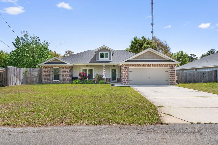 Stunning all brick 3BR/2BA in Gulf Breeze with 2 car garage and no HOA. Built in 2021, this 1,739 sq ft home offers modern finishes and quality construction throughout. The open floor plan centers around a chef's kitchen featuring granite countertops, a large island with bar seating, w/ dovetail soft close drawers, stainless Whirlpool appliances, & porcelain tile that carries through the main living and dining areas w/ tray ceiling, and an abundance of natural light. The primary suite is a true retreat with a tray ceiling, ceiling fan, dual walk in closets & a spa like bath complete with granite vanity, glass enclosed tiled shower, and rainfall showerhead. Two additional bedrooms and a spacious laundryround out the interior. Water heater replaced in 2024. Head outside to to a covered front porch with lush landscaping, a covered back patio, and a fully fenced yard with lawn irrigation. Gulf Breeze schools. Easy access to Pensacola Beach, Navarre Beach, shopping, and dining along Hwy 98. Schedule your showing today.