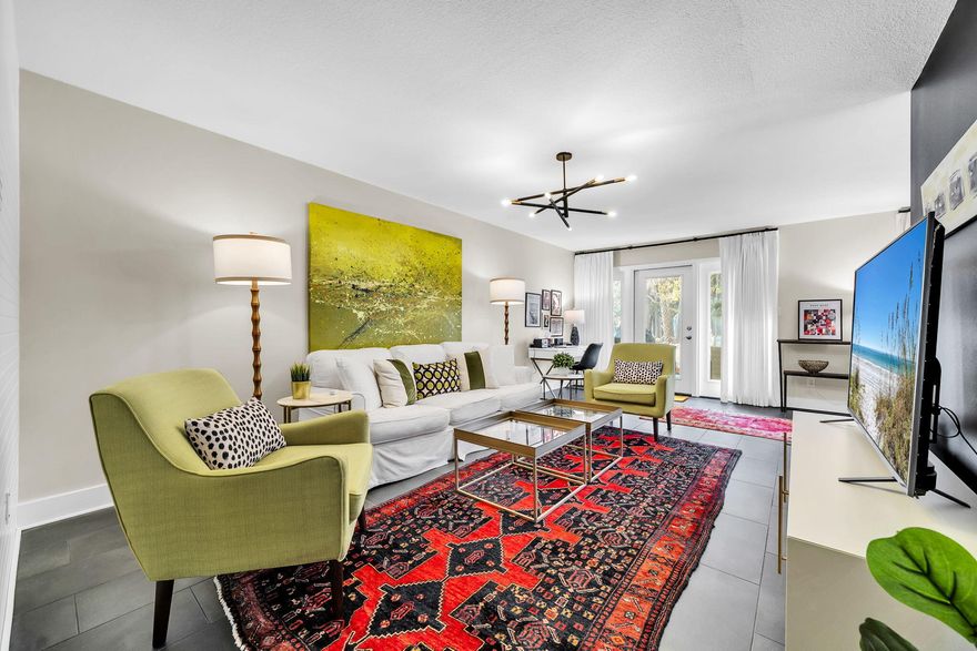 Completely reimagined with a distinctive mid-century modern aesthetic, this beautifully renovated residence in Augusta Village at Sandestin offers a fresh, curated look inside and out. Thoughtfully updated with designer furnishings, custom draperies, new tile flooring, and striking artwork, every space reflects intentional style and quality.
Both bathrooms and the kitchen have been fully renovated with updated fixtures, new faucets, and hardware, complemented by modern lighting installed throughout the home. Recent system improvements include new electrical wiring, a 2024 HVAC system, and a new LG stackable washer and dryer. Interior doors have been replaced, and the home features fresh paint on walls, trim, and cabinetry for a crisp, cohesive finish.