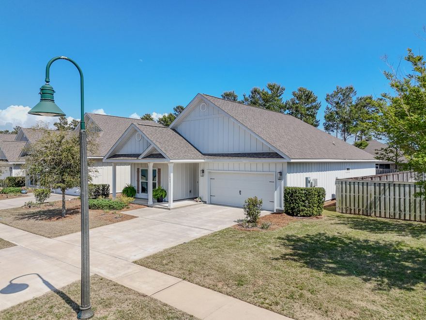 Welcome to this like-new home, gently lived in and thoughtfully designed for comfortable living. The spacious layout creates an inviting atmosphere from the moment you step inside. Located within the gated Firefly neighborhood of Hammock Bay, residents enjoy low-maintenance living with landscaping included in the HOA, along with access to a private pool, clubhouse, and pickleball courts--all just a short walk from your front door. The primary suite features a private ensuite bath and two walk-in closets, offering both convenience and ample storage. Throughout the home, you'll find 9-foot ceilings, with crown molding accents in the main living area and primary bedroom for an added touch of elegance. Step outside to enjoy a fully fenced backyard designed for both privacy and relaxation. A rear gate provides direct access to a scenic trail leading to a wooded area, creating a peaceful and secluded outdoor setting.