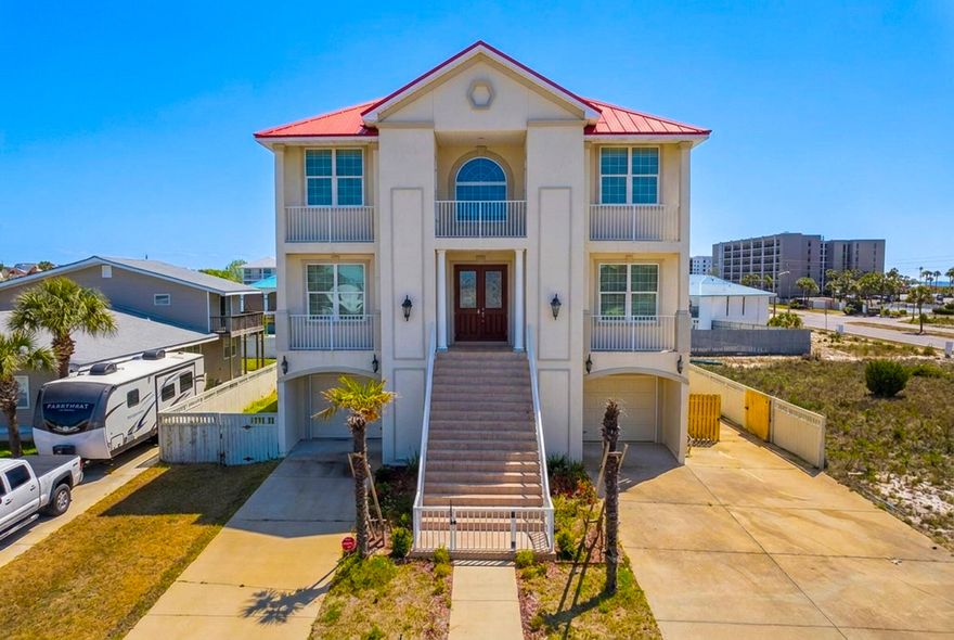 This large home with its gulf views and location across the street from a beach access is perfect for family getaways or company retreats.  As you walk into the house you are instantly hit with an elegant 20' foyer that is highlighted by a ceiling decorated as if you were looking at the sky and sets your mood perfectly for your stay at the beach.  There is an elaborate hardwood staircase, beautiful chandeliers, and comfortable furniture place throughout the house. The enormous kitchen is a gourmet's dream, with a large island/breakfast bar, with granite counter tops, white cabinets, and stainless-steel appliances.  As you explore the first floor you will find another family room, full kitchen with gas stove, dining room and two more bedrooms for your guests and entertaining.