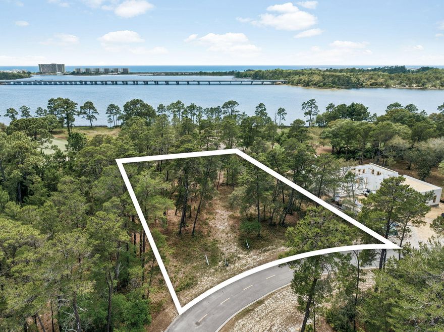 Lot is located on the Sharks Tooth Golf Course with view a beautiful view of Lake Powell. Wild Heron is a 734-acre sanctuary on the shore of Florida's largest coastal dune lake, Lake Powell. You will enjoy the lakefront heated swimming pool, hot tub, fitness center, fishing dock boathouse with kayaks for resident's use to explore Lake Powell, lakefront boardwalk fire pit and a gathering area with fireplace overlooking Lake Powell. Wild Heron is located between Rosemary Beach on Scenic Highway 30A and the west end of Panama City Beach which offers beach, restaurants and Pier Park.