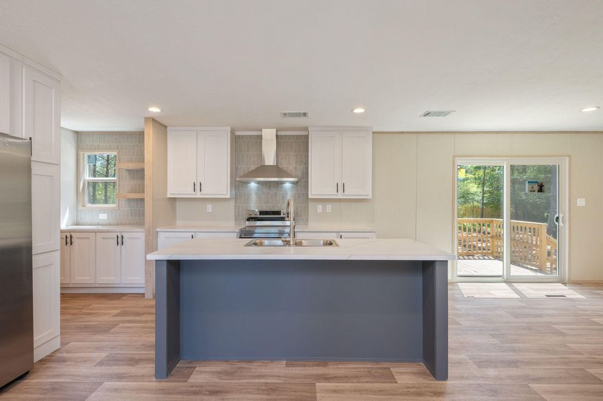 Welcome to this beautiful brand-new 4-bedroom, 2-bath home located on a 3/4 acre lot. Designed with a desirable split floor plan, this home provides added privacy for the primary suite while maintaining a natural flow ideal for everyday living.
The upgraded kitchen is a true highlight, featuring stainless steel appliances, a sleek vent hood, custom color cabinetry, and a dedicated coffee bar that adds both style and convenience. The thoughtful layout makes the kitchen the heart of the home, perfect for gathering with family or hosting guests.
Brick skirting enhances the exterior with durability and curb appeal, while the large back deck creates an inviting outdoor space. With four spacious bedrooms, this home offers flexibility for growing families, guests, or a home office.
