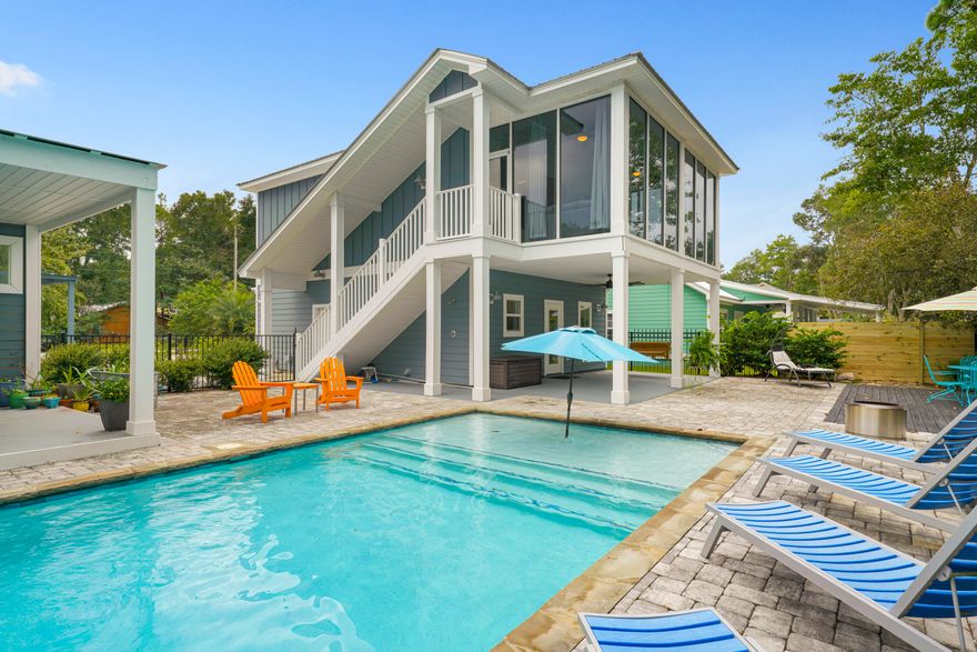 Never miss a day on the water while you build your dream home. Offering 75 feet of waterfront in the heart of Santa Rosa Beach, this rare property combines immediate enjoyment with future potential--and no HOA restrictions. Complete with a private dock, covered boat lift, and direct access to Choctawhatchee Bay, it's designed for effortless days on the water from the moment you arrive. The outdoor living experience is equally inviting, featuring a private pool, expansive multi-level decking, and a fully equipped outdoor kitchen--ideal for entertaining or unwinding after a day on the bay. A charming two-story carriage house offers comfortable accommodations while you plan and build. This 2-bed, 2-bath residence has a full kitchen, dining area, additional living space, and a walk-in closet. Upstairs, a spacious four-seasons room--heated and cooled--boasts floor-to-ceiling windows on three sides, capturing peaceful water views and natural light throughout.

Whether you're envisioning a primary residence, second home, or investment opportunity, this property delivers a rare chance to enjoy waterfront living now while creating something truly exceptional for the future.
