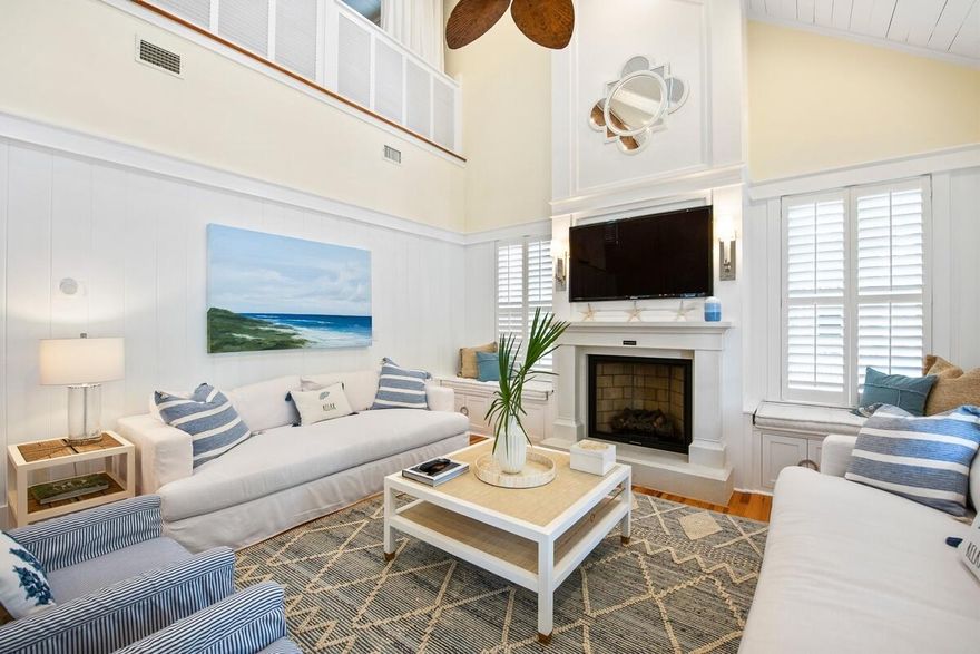 Perfectly positioned just steps from Camp WaterColor and only a short bike ride to Seaside, this fun coastal cottage offers an exceptional blend of charm, comfort, and location. Offered fully furnished and rental-ready, the home presents an effortless opportunity for a refined beach retreat, second home, or investment property. A welcoming, front porch sets the tone for relaxed coastal living and opens into a light filled interior designed for both entertaining and everyday comfort. The open concept living space features wide plank heart pine floors, a vaulted tongue-and-groove ceiling, and a gas fireplace, all complemented by tall sunlit windows and French doors that seamlessly connect indoor and outdoor living. The thoughtfully designed kitchen is equipped with stainless steel appliances, a gas range, granite countertops, and a breakfast bar for additional seating, while the adjacent dining area flows naturally onto the porch, ideal for gathering with family and friends. The main level offers three well-appointed bedrooms, including two primary suites with private baths, as well as a guest bedroom featuring built-in bunks and its own ensuite. Upstairs, a versatile loft, complete with a full bath, game space, and additional sleeping accommodations, perfect for hosting guests or creating a private retreat.
Additional features include plantation shutters throughout, surround sound wiring both indoors and on the porch, a spacious pantry, abundant attic storage, outdoor shower, and ample parking.
As a resident of WaterColor, you'll enjoy access to world class amenities including the recently renovated Beach Club, Camp WaterColor with its resort-style pools, lazy river, and on-site dining, as well as tennis courts, a fitness center, scenic trails, and more, just moments from the renowned boutique shops and dining of 30A. An inviting and timeless coastal escape in one of the area's most sought-after locations.