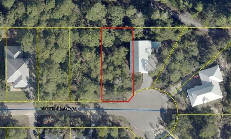 Beautiful wooded lot on the West end of 30a.  Spotted Dolphin is a quiet tree lined one street neighborhood with close proximity to several beach access points and Butler Elementary. This lot would be a wonderful home site for full time, secondary or vacation home.