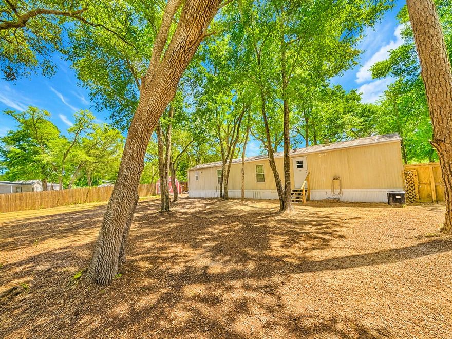 This charming, older 2-bedroom, 2-bath mobile home sits on a beautiful piece of property located in Southport. The home offers a cozy interior with a split floor plan, and outside you'll find a brand-new privacy fence with a double gate on each side and three versatile sheds, ideal for storage or projects. It's a quaint space ready for you to enjoy both inside and out! Great school zone, convenient to shopping, and less than 25 minutes to the beach.