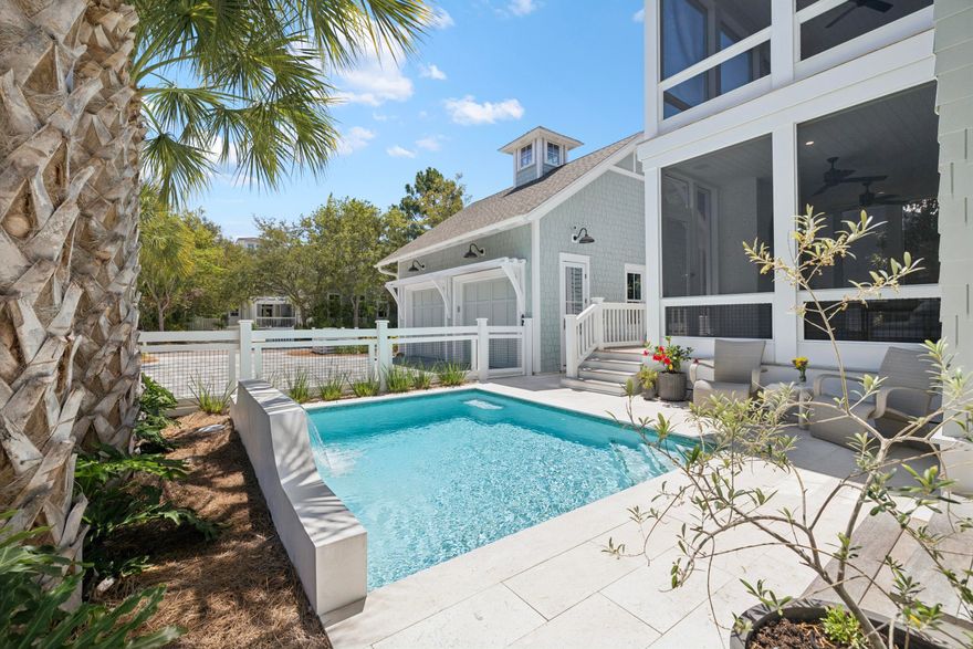 A quiet sense of refinement reveals itself from the moment you arrive, set behind the private gates in the Main Gate of Watersound Beach, where thoughtful architecture and seamless indoor-outdoor living define a home designed for both retreat and gathering. Built in 2022 and meticulously maintained by its original owner, this residence spans nearly 3,200 square feet of carefully considered living space by Allison Ramsey Architects, where every detail feels purposeful and enduring. A welcoming front porch sets the tone, leading into a grand living area anchored by a well-equipped kitchen designed with connection in mind. White oak hardwood flooring, tongue-and-groove walls, and substantial cedar beams lend warmth and character, while a gas fireplace framed in white brick creates a natural focal point. The kitchen is equipped with a Sub-Zero refrigerator, double ovens, six-burner cooktop, wine cooler, and a generous walk-in pantry, offering both beauty and function.

Just beyond, more than 850 square feet of porch space extends the living experience outward, creating a seamless transition between interior comfort and the coastal air. A screened porch with a second gas fireplace and vented grill invites relaxed evenings and effortless outdoor dining, while the private pool offers a refreshing escape after a day at the beach, complemented by a convenient pool bath and adjacent powder room.

The first level also includes a well-appointed guest suite with an ensuite bath, a mudroom-style laundry space with brick flooring, and thoughtful access points designed for everyday ease. Upstairs, the primary suite serves as a private retreat with its own porch, dual closets, and a spa-like bath featuring double vanities, a soaking tub, custom tiled walk-in shower, and a separate water closet. A second primary suite on this level provides flexibility and privacy, while an additional ensuite bedroom, including a bunk room with handcrafted detail, ensures comfortable accommodations for guests. A second laundry area serves the upper level, enhancing the home's livability. Every bedroom enjoys a private bath, creating a true sense of comfort and autonomy throughout.

Positioned on a homesite bordered by lush vegetation, the property enjoys direct access to a network of winding boardwalks that lead through preserved natural landscapes and onward to the turquoise-hued water. The setting is both peaceful and connected, offering proximity to multiple beach accesses, parks, fitness facilities, and gathering spaces, all within a thoughtfully designed coastal environment.

Offered furnished with select exclusions and impeccably maintained, the home also features a two-car garage and generous driveway parking. With more than a mile of private white sand shoreline, miles of scenic boardwalks, and golf cart paths leading to the beach, this is a setting defined by space, privacy, and a distinctly natural coastal experience -- all just moments from the dining and lifestyle offerings along 30A.