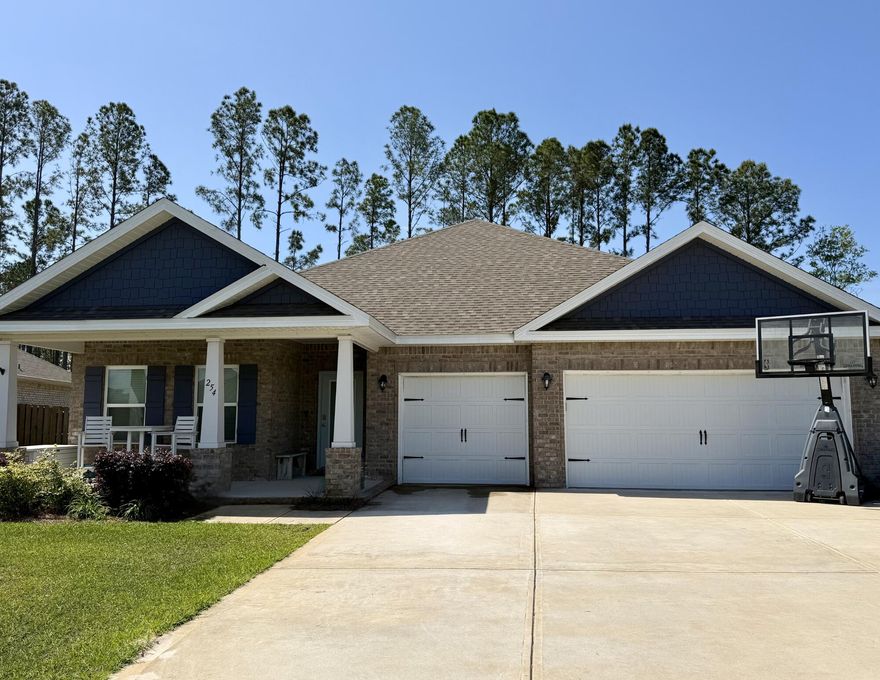 Ready for a home that's practical and perfectly located? This move-in-ready house is large, affordable, and quietly tucked away, yet close to everything. Wood-look tile flows throughout (except guest bedrooms), paired with quartz countertops, a custom backsplash, and pendant chandelier lighting in the kitchen. Blinds make life easier, and the space feels functional and comfortable from day one. Enjoy a fully fenced backyard with, not one, but three private gates--dip out the back to reach the main road or Steamboat Landing on the bay, just half a mile away. Perfect for pets, kids, or just soaking up the outdoors. The 3-car garage is heated and cooled with foam insulation, a mini-split, and an epoxied floor--perfect for a home gym, workshop, or extra storage.