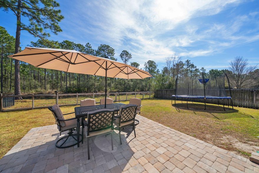 PRIVATE BACKYARD RETREAT backing to Preserve, Under $500K Near 30A!  An immaculate, maintained home with 3 bedrooms, 2 baths with bonus room great for 4th bedroom, office, or workout room. Located in the serene coastal living at Whispering Lake this charming home offers close proximity to beaches, shopping, dining and medical facilities. The large fenced-in yard ensuring privacy with no future development behind. The home has been meticulously cared for with fresh interior paint, luxury vinyl flooring, & new carpet. The expansive living area flows with the spacious kitchen featuring a breakfast bar and dining area. Large master suite with a custom closet, bath with double vanities, walk in shower, and separate tub. The patio has been extended to offer a larger space for outdoor entertaining! The home also includes a double-car garage and showcases a low-maintenance exterior of brick and Hardi-siding. Lots of natural lighting throughout this home. Less than 10 minutes to the World's Most Beautiful Beaches! Enjoy the conveniences of fine and casual dining, shopping, and Sacred Heart Hospital is less than 15 mins away!   Buyer to verify all data and dimensions.