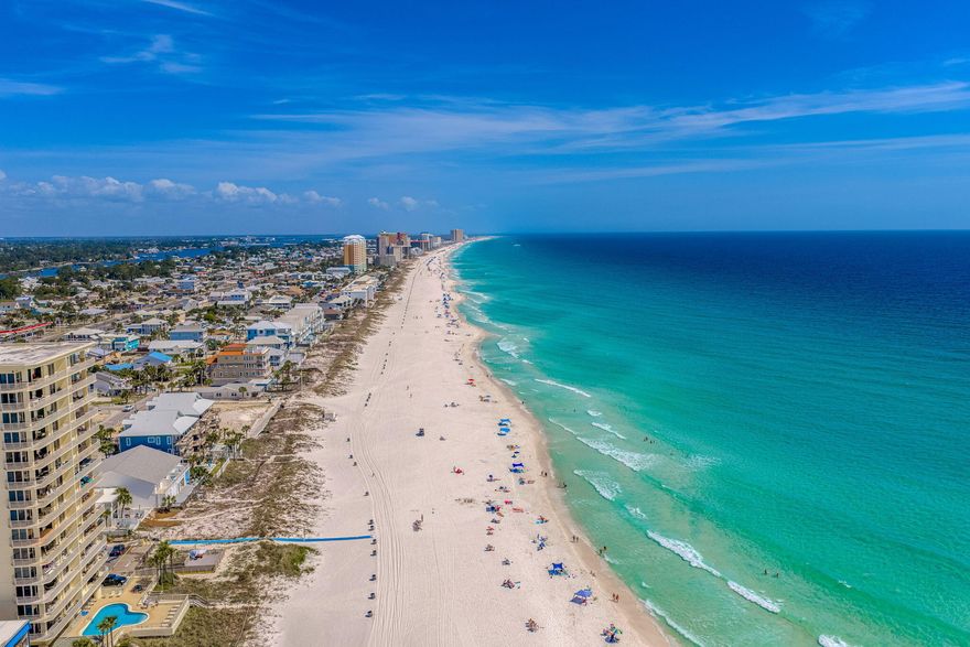 Directly across the street from the Gulf, this 2 bedroom, 2 bathroom townhome offers quick beach access, Gulf views, and updates that help reduce near-term maintenance. Two public beach access points are nearby, and the home is being sold fully furnished, making it a practical option for personal use, a second home, or rental use. For buyers exploring added rental flexibility, the neighboring townhome is also available, creating a rare opportunity to own side-by-side units.

Inside, the layout is set up to comfortably host guests with one king bed and two queen beds. The kitchen, bathrooms, and flooring were renovated in 2019, and the entire unit was freshly painted in 2025, including the walls, trim, and doors.  All furnishings were also replaced in 2025, giving the interior a clean, updated feel. A full-size washer and dryer adds everyday convenience.

The living area opens to a private patio where you can enjoy Gulf views and coastal breezes. A fenced backyard provides private outdoor space to unwind after time at the beach. The home also includes a private garage for beach gear, bikes, and other coastal essentials, plus additional driveway parking for guests.

Nearby destinations include Pier Park, St. Andrews State Park, marinas, waterfront dining, shopping, and local restaurants. Buyer to verify all dimensions.