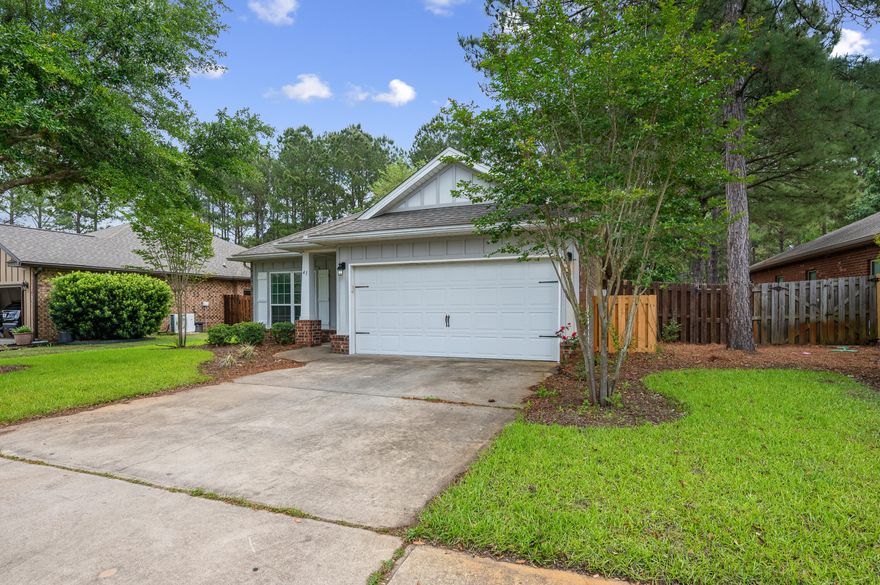 Newer LVP flooring flows through this open-concept Hammock Bay gem at 41 Dickens Dr, Freeport, FL 32439. Vaulted ceilings, granite countertops in kitchen and baths, natural gas range, and a gas fireplace create an elevated living experience. The flexible front room serves as office, study, or formal living. The oversized primary suite features double vanities, garden tub, separate shower, and walk-in closet. A split floor plan ensures privacy for bedrooms two and three. Enjoy a covered, enclosed back porch perfect for year-round entertaining. Hammock Bay amenities include pools, fitness center, walking trails, bike paths, dog park, putting greens, picnic areas, tennis, and basketball -- all minutes from 30a beaches.
