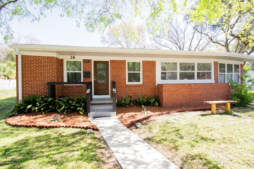 Updated Brick Cottage in Gulf Breeze Proper! This 3 bed, 2 bathroom brick cottage has been newly remodeled with modern updates. The kitchen has been fully renovated with custom cabinetry, tile backsplash, stainless steel appliances, and a pass-through window to the dining area. Enjoy two living spaces with the open-concept front living room and a spacious second living area on the opposite side of the home. The master bathroom features a quartz countertop vanity, new mirrors and lighting, and a tiled shower with a frosted glass door. The second bathroom includes a quartz vanity with a vessel sink, a freestanding tub/shower combo, and updated lighting. Impact-resistant windows bring in natural light, and the utility room offers storage above the brand-new water heater and washer/dryer area Additional upgrades include LVP flooring, fresh paint, a new roof (2022), complete rewire (2023), new HVAC (2023), and a vapor barrier with insulation in the crawl space (2024). The large lot offers mature landscaping and plenty of outdoor space. This home has it all and is priced to sell! Call today for your private showing.