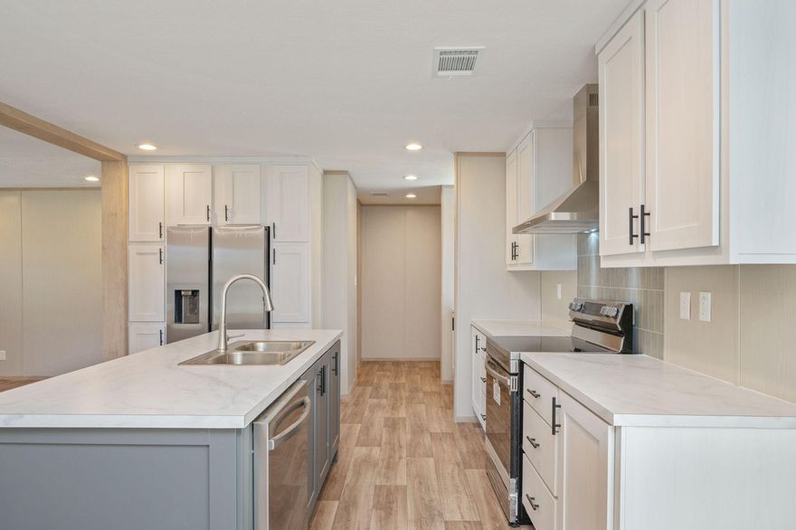 Welcome to this beautiful brand-new 4-bedroom, 2-bath home located on a 1/4 acre lot. Designed with a desirable split floor plan, this home provides added privacy for the primary suite while maintaining a natural flow ideal for everyday living.
The upgraded kitchen is a true highlight, featuring stainless steel appliances, a sleek vent hood, custom color cabinetry, and a dedicated coffee bar that adds both style and convenience. The thoughtful layout makes the kitchen the heart of the home, perfect for gathering with family or hosting guests.
Brick skirting enhances the exterior with durability and curb appeal, while the large back deck creates an inviting outdoor space. With four spacious bedrooms, this home offers flexibility for growing families, guests, or a home office.