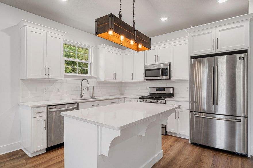 Ideally located in downtown Pensacola, this modern townhome built in 2020 is just minutes from dining, shopping, waterfront attractions & 15min to Pensacola Beach! Updated in 2025 with new paint & luxury vinyl plank flooring - it features 2 large bedrooms WITH additional office/nursery room just off master and 2 bathrooms. With 9 ft ceilings throughout & an open floor plan - the kitchen offers granite, gas range, island, full pantry, and no-slam cabinetry. Washer/Dryer hook-ups in hall with tankless gas water heater. Enjoy exterior side gate access, dual covered patios, exterior storage space, plus a fully fenced yard with sprinkler system. Currently leased at $1850 p/m thru 05/31/2026 - Call today for your private tour!