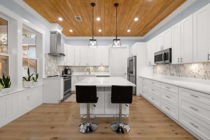 Discover an exceptional 2.5 acre coastal estate in Santa Rosa Beach offering ultimate privacy and zero HOA restrictions. This luxury property provides unmatched freedom for investors and families seeking expansive grounds near the water.

The approach features a scenic drive lined with mature oaks. A resort style pool sits surrounded by spacious patios designed for upscale entertaining.

The detached carriage house offers two bedrooms one bathroom a full kitchen and dual living areas. This space is ideal for generating rental income or hosting guests.

A massive convertible garage features oversized doors built to store tall boats luxury vehicles and RVs.

The expansive grounds include a charming chicken coop and ample room to build a custom pickleball court.