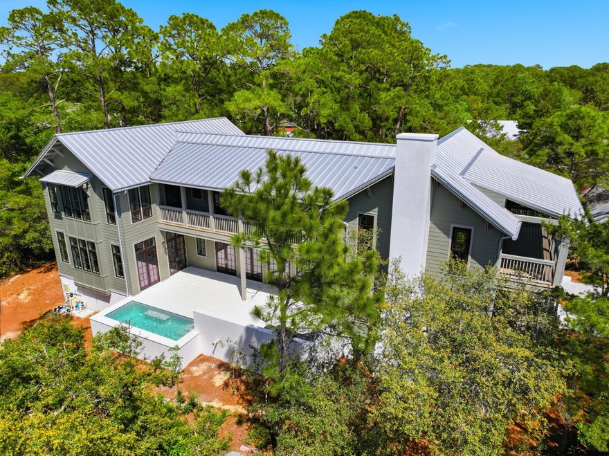 Experience the rare opportunity to own a brand-new custom coastal estate in the exclusive gated community of Lakeplace at Grayton Beach, ideally positioned near the beaches, dining, and lifestyle of Grayton Beach on Scenic 30A. This exceptional 5-bedroom, 5 full bath, 2 half bath residence offers luxury, privacy, and a large lot, rarely found this close to the beach. Set on nearly half an acre, the home encompasses approximately 5,686 square feet of heated and cooled living space with just under 10,000 square feet under roof. Designed for both everyday comfort and grand-scale entertaining, the floor plan blends timeless coastal architecture with elevated modern finishes. The expansive outdoor living area is a true private retreat, featuring a large pool, spacious sun deck, covered lounge areas, and outdoor kitchen, perfect for hosting family and friends or enjoying quiet evenings after a day at the beach. Additional highlights include a three-car garage, oversized driveway, generous guest accommodations, and the peace of mind that comes with brand-new construction. Located in one of the most desirable gated communities near Grayton Beach State Park and the sugar-white sands of the Emerald Coast, this is a rare chance to secure a legacy property in one of South Walton's most coveted settings.