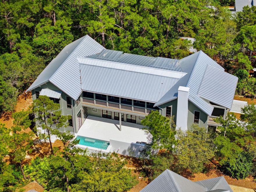 Experience the rare opportunity to own a brand-new custom coastal estate in the exclusive gated community of Lakeplace at Grayton Beach, ideally positioned near the beaches, dining, and lifestyle of Grayton Beach on Scenic 30A. This exceptional 5-bedroom, 5 full bath, 2 half bath residence offers luxury, privacy, and a large lot, rarely found this close to the beach. Set on nearly half an acre, the home encompasses approximately 5,686 square feet of heated and cooled living space with just under 10,000 square feet under roof. Designed for both everyday comfort and grand-scale entertaining, the floor plan blends timeless coastal architecture with elevated modern finishes. The expansive outdoor living area is a true private retreat, featuring a large pool, spacious sun deck, covered lounge  areas, and outdoor kitchen, perfect for hosting family and friends or enjoying quiet evenings after a day at the beach. Additional highlights include a three-car garage, oversized driveway, generous guest accommodations, and the peace of mind that comes with brand-new construction. Located in one of the most desirable gated communities near Grayton Beach State Park and the sugar-white sands of the Emerald Coast, this is a rare chance to secure a legacy property in one of South Walton's most coveted settings.
