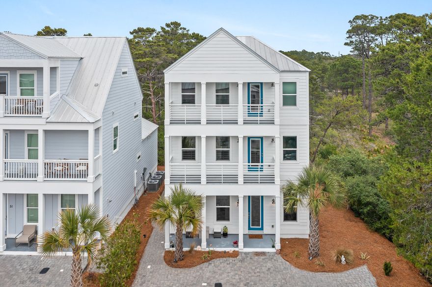 Set on a premium homesite in the northeast corner of Serenity at Dune Allen, this beautifully maintained three-story residence offers a rare sense of privacy along 30A's west end. Green space borders the home to the north and east, creating a quiet natural backdrop that distinguishes the property from others in the community while placing the beach within easy walking distance.

Never rented and presented in like-new condition, this four-bedroom, four-and-a-half-bath home is designed with comfort, flexibility and effortless coastal living in mind. Over 1100 sq. ft. in exterior porch spaces plus extended parking provides a valuable advantage for owners and guests, while the versatile layout supports use as a primary residence, second home or future rental investment. The main living level is bright and inviting, with raised ceilings, abundant natural light and an open-concept design that connects the kitchen, dining and gathering spaces with ease. Modern finishes lend a polished coastal feel, while multiple porches across all three levels invite quiet mornings, afternoon breezes and relaxed evenings outdoors.

All four bedrooms feature ensuite baths and private porch access, offering a thoughtful level of comfort for family and guests. The second and third levels each include two spacious bedroom suites along with flex nooks suited for a home office, reading area or secondary lounge space. A screened rear patio expands the outdoor living experience, providing another shaded place to enjoy the home's peaceful setting.

With a community pool, beach access nearby and one of the more desirable homesites in Serenity at Dune Allen, this home pairs convenience with privacy in a location made for the 30A lifestyle.