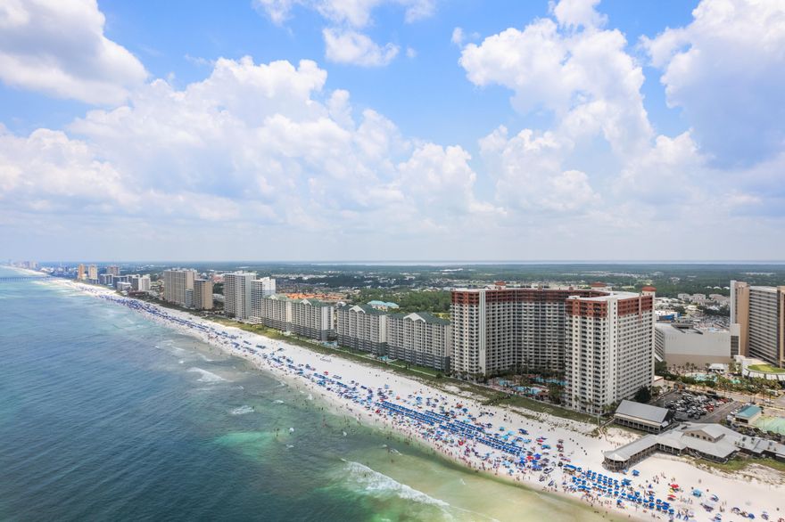 Step into one of Panama City Beach's most iconic resorts - Shores of Panama - and enjoy the rare convenience of a deeded parking space just outside the unit, on the same floor. Skip the elevator waits for exploring and head straight to your door, a luxury most units don't offer.

This SE Gulf-facing unit offers stunning views from the living area and private balcony, perfect for relaxing after a day in the sun. The open layout features granite countertops, tile flooring throughout, and a bunk room with its own door and full bathroom, giving you the privacy and flexibility of a true two-bedroom setup.

Enjoy resort-style amenities including the largest lagoon pool in PCB, indoor pool, spa, sauna, fitness center, and direct beach access. Located steps from dining, Walmart,
