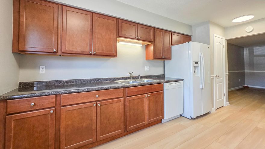 Freshly updated townhome, this 3-bedroom 2-bathroom features NEW VINYL FLOORING AND A FRESHLY PAINTED INTERIOR. The kitchen blends modern updates with easy, livable layout that features beautiful wooden cabinetry and generously sized countertops, while also having a convenient dual pantry hallway. Flowing directly into the living area, the home offers generous living space, with additional storage space. The second floor layout holds the primary bedroom with exceptional space, featuring the primary bath, perfect for privacy and convenience. The additional bedrooms , generously-sized, featuring a beautifully redone full bathroom, providing fresh, modern finishes. This refreshed townhome offers a fully fenced backyard, for added privacy, and a convenient exterior utility closet for extra storage. The inviting community pool is just feet away, offering the perfect extension of outdoor living.