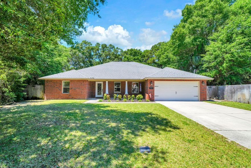 Welcome to 413 Webster St! This 3-bedroom, 2-bathroom home was built in 2014 and offers nearly 2,100 sq ft of living space on 0.37 acres of land. The home features a two-car garage, split floor plan, separate laundry room, and a massive fenced-in backyard with a covered lanai. Entering the home, you'll notice the beautiful tray ceilings and tile flooring in the oversized living room. Flowing into the dining room and kitchen, you'll love the granite counter tops, backsplash, stainless steel appliances, and plenty of storage between the cabinets and the pantry. The primary bedroom offers an en-suite bathroom that includes a walk-in closet, dual vanities, and two separate showers (one of which is a shower/tub combo). The two additional bedrooms share a full bathroom that includes... ... a dual vanity and shower/tub combo. As you make your way to the back yard, you'll enjoy the extended covered patio, additional decking, outdoor shower, and a backyard that offers an abundance of room for entertainment as well as privacy. This property is a fantastic location with easy access to Eglin AFB or the beach. Call for a showing today!