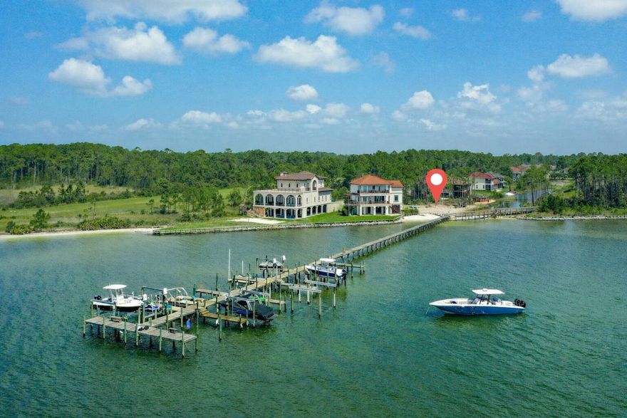 Welcome to the desirable gated community of Palmetto Preserve--home to one of the last remaining waterfront lots in Navarre.

This exceptional property offers pristine water clarity, deeded beach access, and a private boat slip--a rare privilege, as not every home in the community has one. Build your dream home and enjoy immediate access to the water from day one.

Located in East Navarre, Palmetto Lake Preserve is conveniently close to top-rated schools, shopping, and Hurlburt Field Air Force Base, while still offering privacy and tranquility. The low HOA of just $115/month truly delivers value, covering a beautiful gated entrance, underground utilities, well-lit paved roads, a community dock, and meticulously maintained beach access. The lot features approximately 165 feet of total water frontage and spans .39 acres, providing ample space for a luxury custom home. A Geo-Con soil study has already been completed, allowing your builder to review and move forward without delay. In addition, the seller is providing a survey at their expense, along with a potential building floor plan that may be used or customizedvaluable tools to help bring your vision to life.

Nestled in a quiet cul-de-sac, the community is thoughtfully designed with a Y-shaped entrance leading to two cul-de-sacs, creating minimal traffic and a peaceful setting. With only two neighboring waterfront homes, you'll enjoy exceptional privacy.

Spend your days dolphin watching, boating, kayaking, fishing, and soaking up the Florida sunjust minutes from Navarre Beach.

All showings must be accompanied by a REALTOR® due to gated access.

This is truly one of the finest buildable waterfront lots remaining in Navarrea rare opportunity to secure luxury, lifestyle, and long-term value.