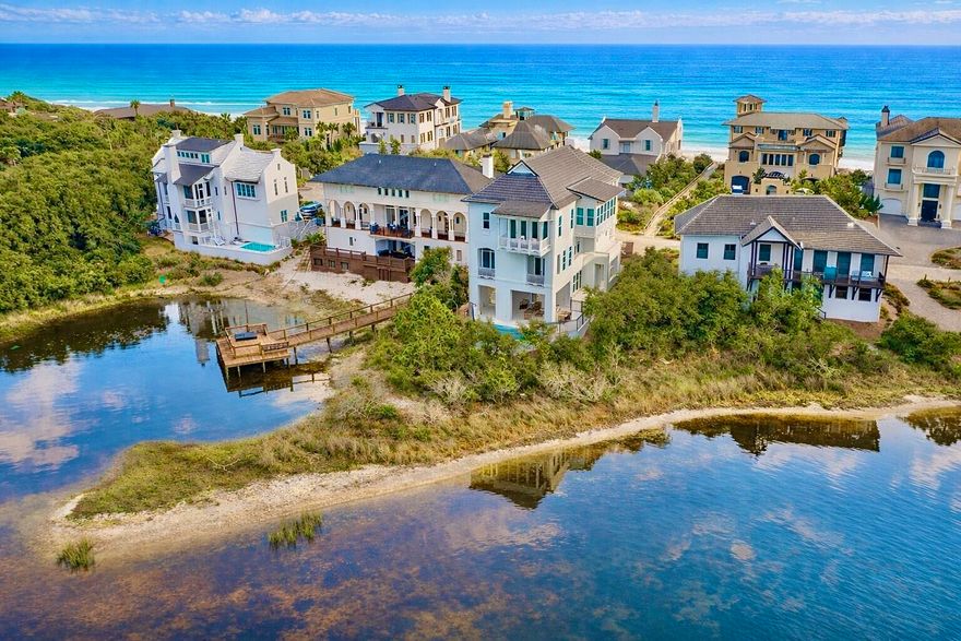 Welcome to an exceptional coastal retreat in the gated, non-rental community of Stallworth Preserve — 68 Stallworth Blvd. This masterfully designed 3-story home, built in 2021, embodies refined beach living with sweeping views of the white sand beach and emerald green waters of the Gulf. As if Gulf views weren't enough, this gem is located on a coastal dune lake as well. Step inside to discover ~3,908 sq ft of living space highlighted by 5 spacious bedrooms and 7 baths (five full, two half). On the ground level you'll find a welcoming entry, laundry area, a two-car attached garage, and an amazing outdoor living area complete with a summer kitchen and a private pool — all overlooking the serene coastal dune lake. Upstairs, four bedrooms each come with their own ensuite bath, offering privacy and comfort for residents or guests. The top floor is dedicated to living at its finest: a luminous living room, dining area, and gourmet kitchen all arranged to maximize the stunning Gulf and lake views. Also on this level is an expansive master suite, making this the ultimate retreat space. This home combines beach house charm with modern amenities: double-pane windows, storm-ready doors, ceiling fans, a tankless water heater, and efficient electric systems. Outside, the property sits on an ~8,712 sq ft lot in a private, secluded enclave with direct beach access located just across the driveway. A rare find in this prized 30A neighborhood. Whether you're seeking a luxury retreat, a coastal vacation base, or a high-end investment property, 68 Stallworth Blvd presents a rare opportunity combining privacy, panoramic water views, and turnkey elegance, in a location that offers both serenity and access to the Gulf.