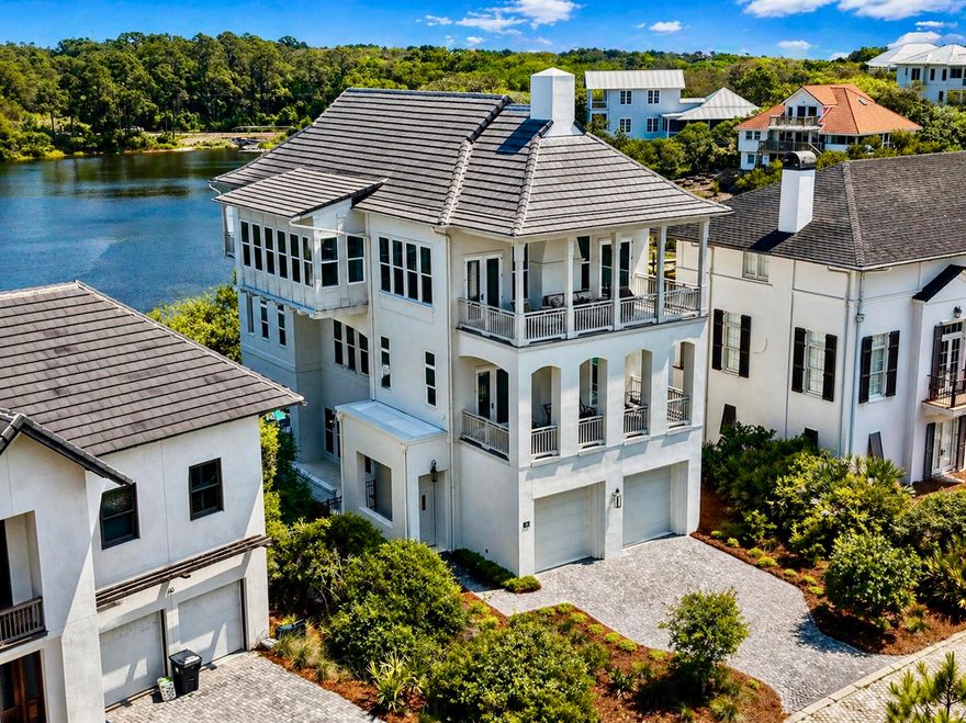 Welcome to an exceptional coastal retreat in the gated, non-rental community of Stallworth Preserve — 68 Stallworth Blvd. This masterfully designed 3-story home, built in 2021, embodies refined beach living with sweeping views of the white sand beach and emerald green waters of the Gulf. As if Gulf views weren't enough, this gem is located on a coastal dune lake as well. Step inside to discover ~3,908 sq ft of living space highlighted by 5 spacious bedrooms and 7 baths (five full, two half). On the ground level you'll find a welcoming entry, laundry area, a two-car attached garage, and an amazing outdoor living area complete with a summer kitchen and a private pool — all overlooking the serene coastal dune lake. Upstairs, four bedrooms each come with their own ensuite bath, offering privacy and comfort for residents or guests. The top floor is dedicated to living at its finest: a luminous living room, dining area, and gourmet kitchen all arranged to maximize the stunning Gulf and lake views. Also on this level is an expansive master suite, making this the ultimate retreat space. This home combines beach house charm with modern amenities: double-pane windows, storm-ready doors, ceiling fans, a tankless water heater, and efficient electric systems. Outside, the property sits on an ~8,712 sq ft lot in a private, secluded enclave with direct beach access located just across the driveway. A rare find in this prized 30A neighborhood. Whether you're seeking a luxury retreat, a coastal vacation base, or a high-end investment property, 68 Stallworth Blvd presents a rare opportunity combining privacy, panoramic water views, and turnkey elegance, in a location that offers both serenity and access to the Gulf.