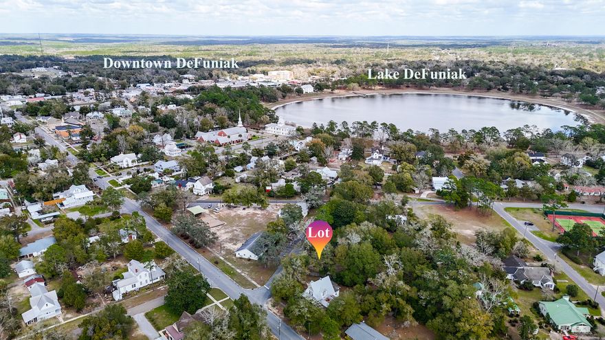 Rare vacant lot in historic district of DeFuniak Springs, FL! Both water and sewer taps are paid, lot has been partially cleared with some beautiful, large oaks left to frame your new construction. Lot is level and across the street from Florence Park and the Scout Hut. Only a few blocks to beautiful Lake DeFuniak and 30 minutes to the sugar white sands of Walton County beaches. There are VERY few vacant lots left in the historic district with this as the only one available at this time. Don't miss your opportunity to be a part of the DeFuniak Springs renaissance!