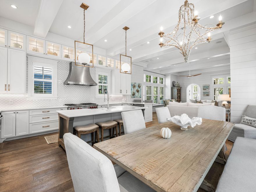 Discover a coastal masterpiece in the exclusive, gated community of Watersound Beach. This stunning, furnished home spans an impressive 4,445 square feet and encompasses five bedrooms, six bed bunkroom, five full baths, one half-bath, two living areas, a two-car garage, a heated pool, and a tower with Gulf views. Seamlessly blending luxury with innovative design, the residence fronts the serene Signal Park green space.
The journey begins on the main level, where an open-concept living area with high, beamed ceilings flows into a chef's kitchen. The kitchen is equipped with a 48'' Wolf dual fuel range, a Sub-Zero refrigerator and freezer, an ice maker, and a beverage fridge.  Both the spacious island adorned with marble countertops and the dining area overlook the pool, while a multitude of windows floods the space with natural light. This level also includes a guest suite with a full bath, walk-in closet, and private screened porch. Outside, the heated pool provides a private oasis with a large sun shelf and unique water feature, while the lush, fenced courtyard includes an outdoor shower, the perfect spot for rinsing off after a day at the beach.

Take the stairs or the elevator that services the first 3 levels and find the extraordinary primary suite, featuring vaulted ceilings, multiple seating areas, and a private porch. The spa-like ensuite bathroom is complete with dual vanities, a makeup area, a generous shower, a soaking tub, and a large walk-in closet. Also on this floor is a truly unique three-story bunk retreat, which provides access to a loft and the media room, and a full bath. This level also features an oversized guest bedroom over the garage, complete with a sitting area, a full bathroom, and a kitchenette that includes a sink, refrigerator, microwave, and dishwasher. An additional guest bedroom with a full bathroom and a pool-view porch off the spacious hallway complete this level.

The third floor offers a spacious secondary living area, the perfect spot to watch a movie with family and friends. Heading up the stairs is the open-air tower, which provides stunning views of the Gulf and spectacular sunsets.

The gated Watersound Beach community is located south of Scenic Highway 30A, offering homeowners a rare sense of seclusion alongside easy access to area activities. Amenities include swimming pools, a putting park, community green spaces, a state-of-the-art fitness center, and private boardwalks leading to one of the most beautiful stretches of coastline in the area. Embrace unparalleled coastal living- your sanctuary awaits in Watersound Beach!