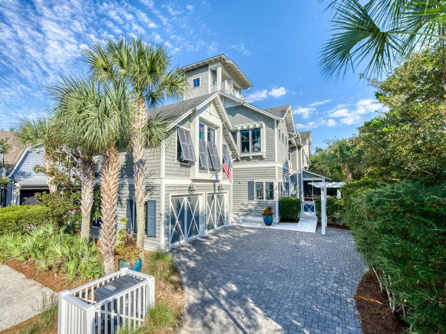 Discover a coastal masterpiece in the exclusive, gated community of Watersound Beach. This stunning, furnished home spans an impressive 4,445 square feet and encompasses five bedrooms, six bed bunkroom, five full baths, one half-bath, two living areas, a two-car garage, a heated pool, and a tower with Gulf views. Seamlessly blending luxury with innovative design, the residence fronts the serene Signal Park green space.
The journey begins on the main level, where an open-concept living area with high, beamed ceilings flows into a chef's kitchen. The kitchen is equipped with a 48'' Wolf dual fuel range, a Sub-Zero refrigerator and freezer, an ice maker, and a beverage fridge.  Both the spacious island adorned with marble countertops and the dining area overlook the pool, while a multitude of windows floods the space with natural light. This level also includes a guest suite with a full bath, walk-in closet, and private screened porch. Outside, the heated pool provides a private oasis with a large sun shelf and unique water feature, while the lush, fenced courtyard includes an outdoor shower, the perfect spot for rinsing off after a day at the beach.

Take the stairs or the elevator that services the first 3 levels and find the extraordinary primary suite, featuring vaulted ceilings, multiple seating areas, and a private porch. The spa-like ensuite bathroom is complete with dual vanities, a makeup area, a generous shower, a soaking tub, and a large walk-in closet. Also on this floor is a truly unique three-story bunk retreat, which provides access to a loft and the media room, and a full bath. This level also features an oversized guest bedroom over the garage, complete with a sitting area, a full bathroom, and a kitchenette that includes a sink, refrigerator, microwave, and dishwasher. An additional guest bedroom with a full bathroom and a pool-view porch off the spacious hallway complete this level.

The third floor offers a spacious secondary living area, the perfect spot to watch a movie with family and friends. Heading up the stairs is the open-air tower, which provides stunning views of the Gulf and spectacular sunsets.

The gated Watersound Beach community is located south of Scenic Highway 30A, offering homeowners a rare sense of seclusion alongside easy access to area activities. Amenities include swimming pools, a putting park, community green spaces, a state-of-the-art fitness center, and private boardwalks leading to one of the most beautiful stretches of coastline in the area. Embrace unparalleled coastal living- your sanctuary awaits in Watersound Beach!