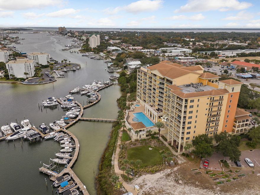 Marbella condominium in the heart of Destin offers a prime location for enjoying the vibrant coastal lifestyle.  Since December of 2020, the seller has made several upgrades ensuring this unit is move in ready.  These include; fresh paint throughout, including the ceilings.  New luxury vinyl plank flooring throughout.  New drapes and blinds for added style and privacy.  Quartzite kitchen countertops with a new sink and kitchen aid appliances.  This unit has two ovens.  A new Trane HVAC and a new water heater (12/2020).  Brand new sliding screen doors 2025.  Kenmore Elite extra large capacity washer and dryer in the laundry room.  This unit has 10 foot ceilings in the living room, dining area, and bedrooms. Other units only have 9 ft ceilings. Some of Marbella's amenities include a pool, hot tub, and exercise room. This condo is one you don't want to miss.  Schedule your appointment today.