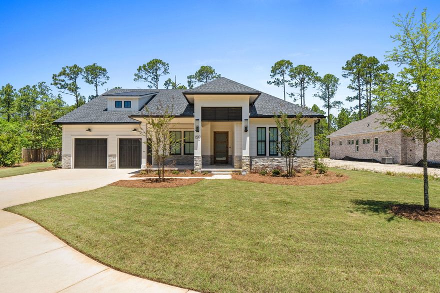 Stunning Randy Wise custom-built 4 bedroom, 3 bath home sits on spacious 1/3-acre private fenced lot on quiet cul-de-sac. This dream home backs to 120 acre nature preserve in the highly desirable Steamboat Landing at Hammock Bay. Offering 10ft ceilings, 8ft doors, and an abundance of premium upgrades, this lightly occupied part-time residence (since August 2025) shows like new with all warranties still in effect.Step inside the striking 42'' custom wood & glass front door with wireless keypad and Ring doorbell. Engineered hardwoods flow throughout the home, complemented by custom wood shades and curated lighting fixtures throughout. The gourmet kitchen boasts a Wolf range, modern hood, microwave, oversized refrigerator/freezer, walk-in pantry with ice maker and beverage cooler, and a beautiful Kohler white apron sink. The oversized primary suite features shiplap accent walls, pendant lighting, a custom closet with laundry access, and an oversized primary bath with his-and-her vanities and a large zero-entry shower with multiple shower heads. All showers in the home are zero-entry. Additional highlights include a large family room with tiled fireplace, Sonos sound system, upgraded tile in all bathrooms, Rinnai tankless water heater, and WiFi-enabled security system and oversized garage and door. Outdoor living is exceptional: A large screened porch with shellstone tile & stacked stone gas fireplace opens to an outdoor kitchen complete with grill, hood, and sink. Enjoy evenings lounging in the outdoor living room and eating al fresco with beautiful Florida breezes. The oversized 2-car garage offers room for a golf cart and currently stores a 21ft boat with outboard motor. Additional features include epoxy-coated garage floor, keypad entry for garage doors with motion sensor lighting, pre-wired pool panel, pre-wired for generator, storage loft above garage, and a well for irrigation with water filtration system for iron removal. New washer and dryer are negotiable.

This home is a short walk to the Bayfront Clubhouse and 500' pier, and within ten minutes of two other amenity centers offering four swimming pools, fitness centers, court sports, brewery, Windmills Town Center, General Store and walking trails, all offering the perfect blend of luxury, privacy, and coastal Florida living in Steamboat Landing at Hammock Bay! Buyer to verify all information and dimensions important to them.