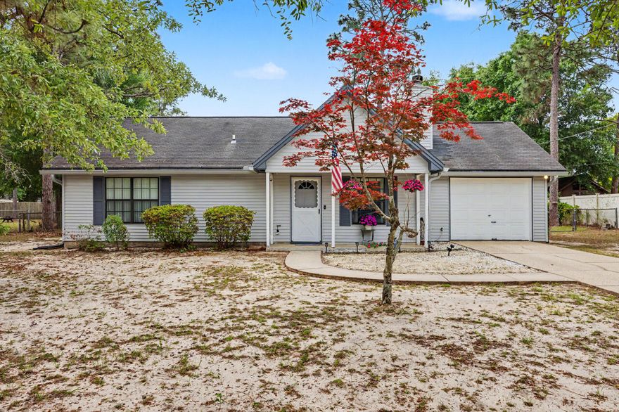 LOCATION, LOCATION, LOCATION! This home is perfectly located outside of city limits in South Crestview- allowing for a short commute! This quaint home sits on a open, flat parcel with an attached 1 car garage and a 10'x12' workshop with power! The fully fenced backyard is a relaxing place to spend your afternoons and weekends. Inside you will find an updated kitchen with newer appliances and fresh paint that overlooks the living room with fireplace and woodbeam ceiling. The primary bedroom has a walk-in closet and a separate entrance to the full bath. BRAND NEW carpet in all 3 bedrooms! The laundry area offers additional storage space as well. This home is ready for you to move right in- schedule your showing today!