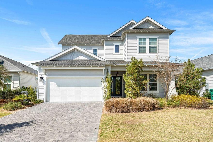 Lowest Priced 5 Bedroom home in the entire community! Located within Naturewalk at Watersound Origins this Orchid plan offers exquisite finishes and tile selections, cathedral ceilings, a two-car attached garage, and a spacious porch with a summer kitchen. The primary bedroom on the first floor features a large ensuite bathroom with a walk-in shower, a separate deep soaking tub, and a walk-in closet. There are also two additional first-floor bedrooms and two additional bedrooms on the second level. Neighborhood amenities include a resort-style pool, tennis and pickleball courts, a fitness center, and the Origins Golf Course. Additionally, there are miles of bike trails and access to the Lake Powell dock for fishing or kayaking.