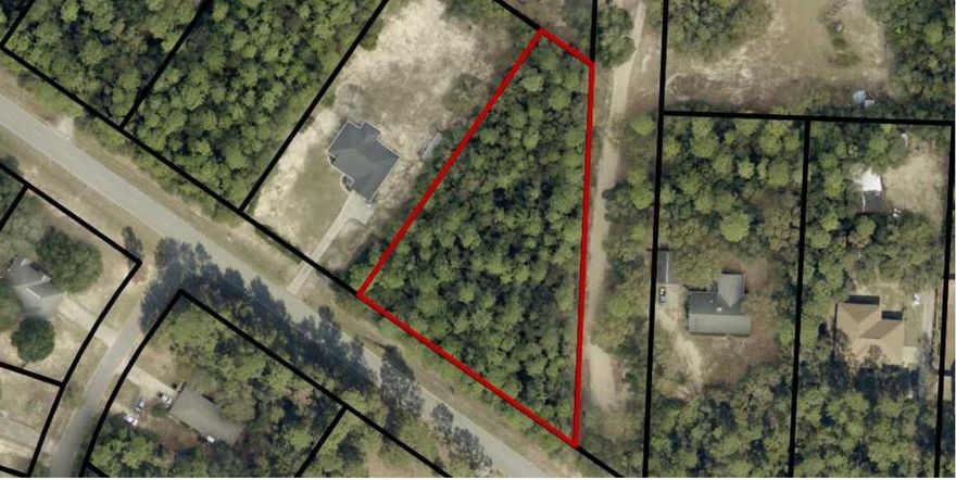 Discover the potential of this 1.25-acre residential parcel, offering a blank canvas for your future home or investment. This uncleared property provides a natural setting with endless possibilities to design and build to your vision. With residential zoning in place, you have the flexibility to create a private retreat or primary residence. No utilities are currently installed, allowing you to customize development to your specific needs. Don't miss the chance to bring your plans to life on this spacious homesite! This lot is located on an Access Management Road; Willard Norris Rd is a minor arterial road.  We govern the placement of the driveways, when development starts, the owner will need to apply for an Access Management Application for the driveway location.  >> This lot was grandfathered in for one drive, so it won't meet the distance requirements.  This property is in Zone X- area of minimal flooding.