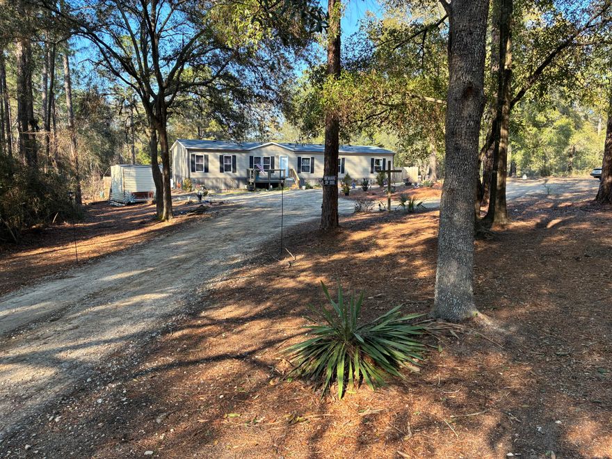 HIGH & DRY / Flood Zone X / Zillow's Flood Zone Info below is INCORRECT. Secluded paradise at the end of a private, gated, crushed concrete drive, where 5.84 ac. of Florida wilderness meets a meticulously maintained homestead designed for true self-sufficiency. This is more than a home; it's a private ecosystem featuring fruit trees and 1,261' of a KINGS LAKE FED CLEAR CREEK. The creek and orchard are a homesteader's dream. There's a massive variety of mature fruit and nut trees including Asian Plum, Guava, Fig, Peach, Cherry, Pear, Citrus, and more. Complemented by raised garden beds, a greenhouse, and a pro composting system plus extras. Features maintained ATV riding trails with jumps & mini golf. $10k Culligan water filtration. Large, powered shop / studio. Perm. Attached MH. Must see Welcome to 507 Stewart Drive
The Ultimate Private Creek-Front Estate
Introduction: A Rare Opportunity in DeFuniak Springs
Are you searching for the perfect balance of modern comfort and rugged outdoor freedom? Welcome to 507 Stewart Drive, a stunning 5-bedroom, 3-bathroom residence nestled on 5.84 pristine acres in the highly coveted Kings Lake area. Built in 2021, this spacious manufactured home still boasts that "new home" feel, offering plenty of room to spread out without a neighbor in sight. Whether you are an avid gardener, a hunting enthusiast, or an ATV rider, this property is designed for those who value privacy and the great outdoors.

The Entrance: Seclusion Meets Curb Appeal
From the moment you arrive, you'll notice the natural green buffer and secure double-gated fence line providing total peace of mind. The approach is as functional as it is beautiful; the owners invested $8,000 in a premium crushed concrete driveway, ensuring your vehicles stay clean while maintaining the rustic elegance of a country estate.

Hobbyist's Paradise: Workshop, Greenhouse, & Entertainment
This property is a dream for the "do-it-yourself" enthusiast. Highlights include:
" Powered Workshop/Studio: A versatile space ready for your hobbies, or easily convertible into additional living quarters.
" Gardener's Dream: Includes a dedicated greenhouse, raised garden beds, and hundreds of dollars in high-quality planters to       jumpstart your botanical oasis.
" Outdoor Living: Relax on the expansive multi-level back deck overlooking a custom-landscaped mini-golf green.
" Family Fun: Custom oversized steppingstones lead the way to a large children's playhouse (which can stay or be removed at the buyer's request).

Adventure at Your Doorstep: ATV Trails & The Creek
For the thrill-seekers, the backyard features professionally landscaped ATV trails, complete with wide roads and two custom jumps.
The crown jewel of the estate, however, is the 1,261 feet of clear, lake-fed creek winding through the property. The owners have cleared two private trail access points leading down to the water's edge. There, you'll find a charming elevated tiny house--the ultimate off-grid retreat--perfect for creek-side camping or enjoying the solar-powered ambiance at night.
A Natural Wildlife Corridor
Located near the expansive Kings Lake, this property acts as a "natural highway" for Florida's local fauna. Because hunting hasn't been permitted on-site, the wildlife is incredibly peaceful. It is common to see deer grazing in the backyard even while you're outside. The owners have frequently spotted:
" Deer & Fox
" Bobcats (The Florida Lynx)
" Coyotes

Pure Luxury: The Water System
Forget the typical issues associated with rural living. This home features a deep well equipped with a $10,000 Culligan Water Filtration system. You will enjoy bottled-water quality from every tap, free of iron deposits or odors. From the taste of your morning coffee to the luxury of a soft-water shower, this system provides a level of pampering rarely found in a country setting.
________________________________________

507 Stewart Drive isn't just a house; it's a lifestyle. Come experience the seclusion, the wildlife, and the endless possibilities of this DeFuniak Springs gem.