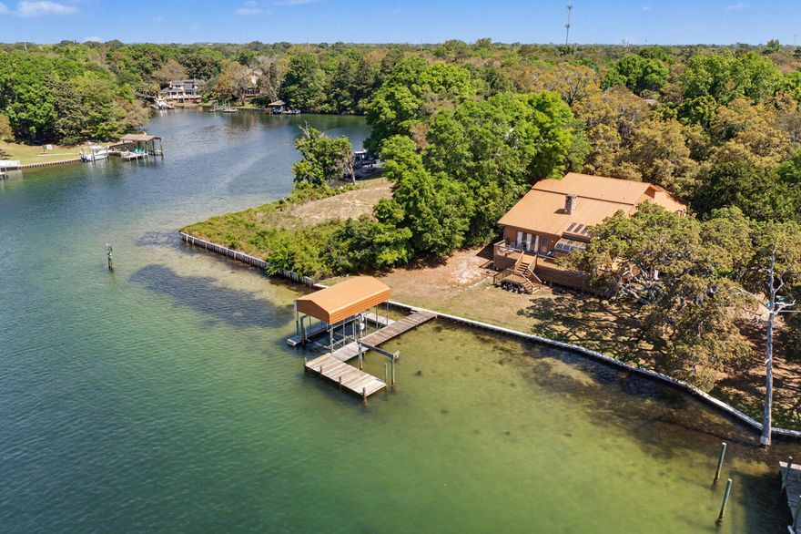 Rare Waterfront Opportunity on Cinco Bayou - One Owner Home!



Don't miss this limited opportunity to own a one-owner waterfront home on beautiful Cinco Bayou, where you can enjoy serene views and even watch dolphins from your own backyard. Situated on a generous .32-acre lot, this property offers endless potential to create your dream coastal retreat.



This spacious home features 3 bedrooms, 3 full baths, and a 3-car garage, with a layout designed for both comfort and functionality. The great room makes a statement with soaring wood-paneled ceilings and walls, anchored by a stunning stone fireplace. The kitchen is generously sized with Corian countertops, a large island with JennAir downdraft range, custom wood cabinetry with pull-outs, and a bright breakfast nook overlooking the water The primary suite is conveniently located on the first floor and includes an oversized walk-in closet and direct access to the guest bath. Upstairs, you'll find two additional bedrooms, a full bath with double vanities, a spacious landing, and access to an upper deck offering panoramic bayou views.

Additional highlights include a durable metal roof, cedar siding, elevated construction (home has never flooded), two laundry areas, and abundant storage throughout. Relax year-round on the screened porch or take in the peaceful waterfront setting from multiple vantage points.

While the home could benefit from some updates, it presents a rare chance to customize a solid, well-built waterfront property in a highly desirable location.

Schedule your private showing today and explore the possibilities!