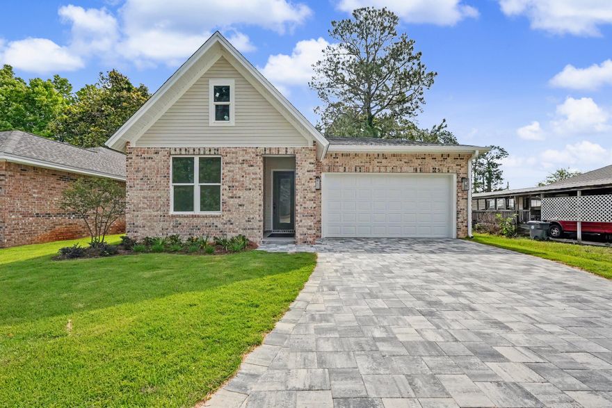 Gorgeous brand-new construction offering a thoughtfully designed split floor plan, high-end finishes, and exceptional functionality throughout. This home features a two-car garage with attic storage above and an upgraded paver extended driveway for added convenience and curb appeal.

Upon entry, you're welcomed by a wide hallway, soaring ten-foot ceilings, and beautiful French oak luxury vinyl plank flooring that flows seamlessly throughout the home. The spacious living area is filled with natural light and complemented by upgraded lighting fixtures, creating a warm and inviting atmosphere ideal for both relaxing and entertaining.

The kitchen is a true centerpiece, featuring stylish two-tone cabinetry, a large island, a walk-in pantry, and ample space for gathering and everyday living. The private primary suite is tucked away at the back of the home, offering peaceful views of the fully fenced backyard. The ensuite bath is beautifully appointed with custom designer tile, a large walk-in shower, dual vanities, and a separate water closet.

Secondary bedrooms are located off the front hallway, providing privacy for guests or family, with one bedroom featuring a walk-in closet. The guest bathroom includes a tiled surround bathtub and shower combination with upgraded finishes.

Just off the garage, you'll find a convenient landing zone complete with custom built-ins and hooks--perfect for keeping everyday essentials organized.

With its modern design, quality craftsmanship, and desirable layout, this move-in-ready home is the perfect blend of comfort and style.