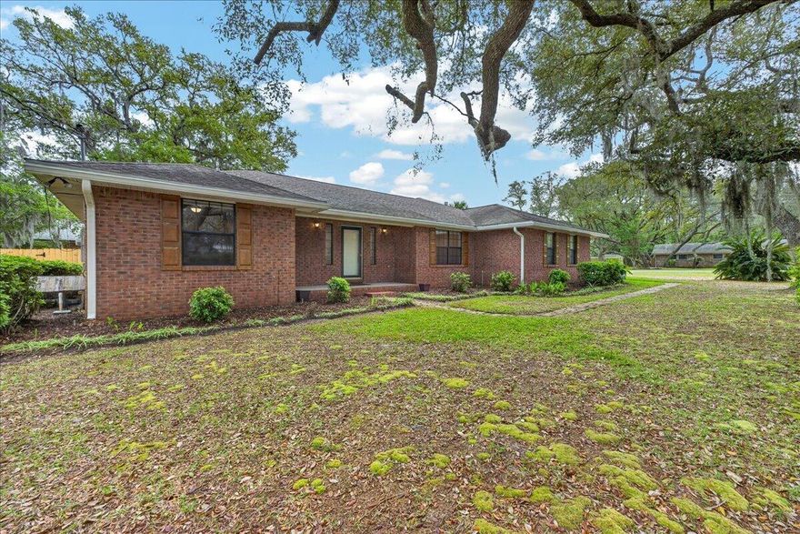 Situated on a beautiful corner lot in the desirable Poquito Bayou area, this home is surrounded by mature live oaks that provide exceptional shade, privacy, and standout curb appeal! With no HOA and a prime location just off Hurlburt Road, you'll enjoy convenient access to the Poquito Boat Ramp (within a mile), Eglin AFB (under 4 miles), VPS Airport (15 minutes), and the beach (within 9 miles). Inside, the home has been refreshed with fresh paint throughout and new LVP flooring in the main living areas, kitchen, and all bedrooms. The living room features abundant natural light, a vaulted ceiling and a cozy brick fireplace, creating a warm and inviting focal point. A formal dining room offers flexibility and can easily serve as a home office, playroom, or gym. The kitchen includes a sunny b reakfast nook and all black appliances. The split primary suite offers privacy and features an en suite bathroom with double vanities, a large walk-in closet, a garden tub, a tiled walk-in shower, and a separate water closet. Each additional bedroom also includes its own walk-in closet and enjoys peaceful views of the surrounding trees. A full bathroom with a tub/shower combo is conveniently located between the secondary bedrooms. Step out back to a spacious open deck, perfect for grilling or relaxing, a large shade tree, and a storage shed for added convenience. With its location near Eglin AFB, this property also presents strong rental potential! This home offers a great location and so much charm, making it an excellent place to call home or a smart investment opportunity!