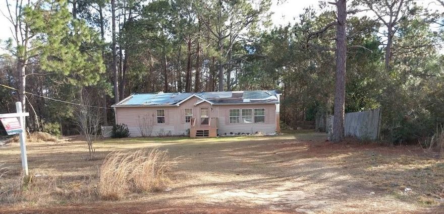 Being sold AS-IS. This three bedroom two full bathroom home features over 2000sqft of split floor plan. Interior offers a living room with vaulted ceilings and fireplace and plant ledges. Kitchen has tons of counter top/ work area, cabinets with glass doors and center island. Dishwasher and built-in microwave do convey. Off the kitchen is sun room or Florida where so much natural light comes in. Master bedroom boasts vaulted ceilings and large closet.