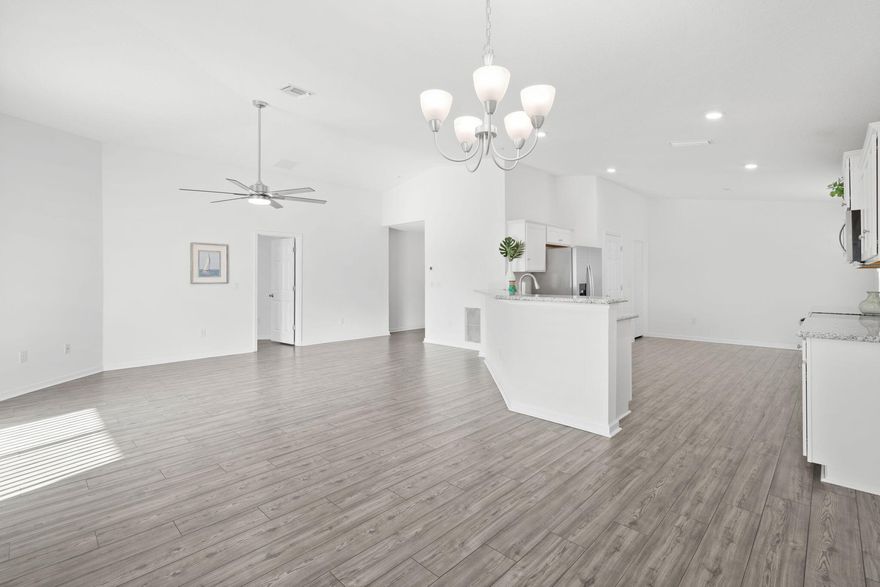 LIKE NEW, 2022 Holiday Builder Home in great neighborhood w/comm pool, gym & dock! Located S.of Hwy 20, Publix, restaurants & schools are close by, while at the same time enjoy the white sandy beach & crystal blue waters of the Gulf just 20 min away! Taking center stage, this Home's big, eat-in kitchen w/granite counters, pantry & large eating bar flows effortlessly into the spacious living area. It's oversized, master suite, located away from the other BR's, provides privacy & plenty of room for a sitting or office area.  A small, LOW maintenance yard w/covered patio provides the ideal spot for your morning coffee or dining al fresco. Close by, the comm pool, dock & gym allow you to enjoy the Fl. lifestyle WITHOUT YOU having to worry about any of the upkeep. Come see this Home today!